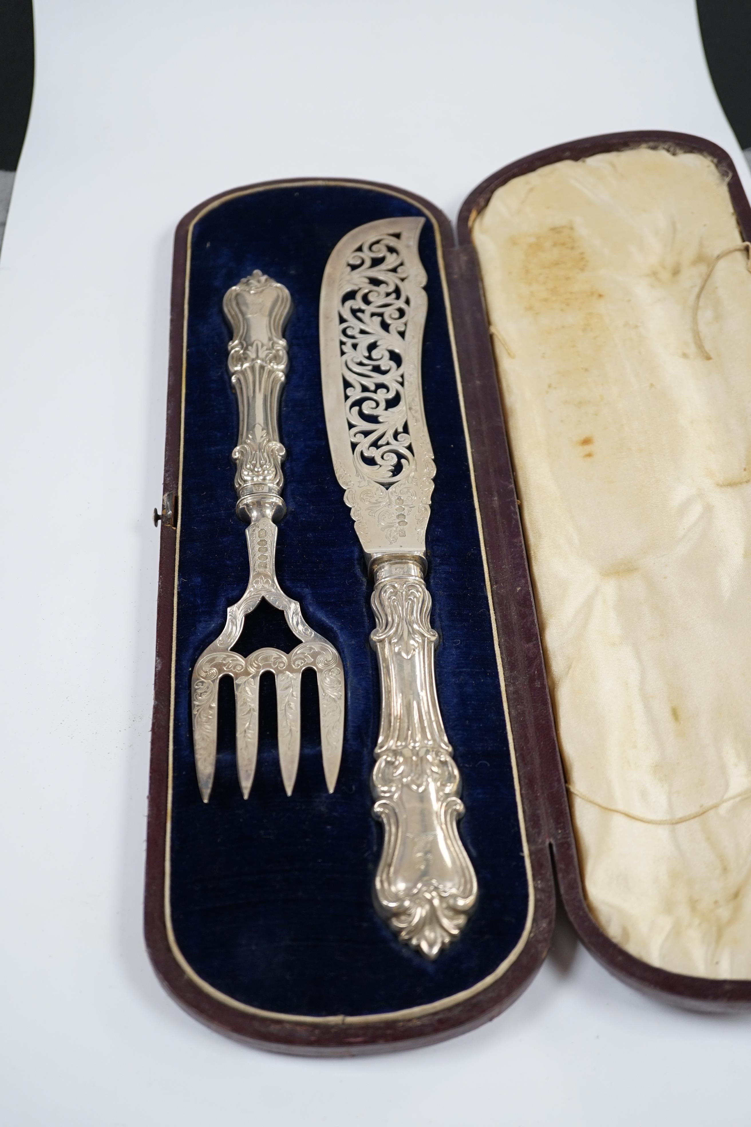 A cased pair of Victorian fish servers, by John Gamage?, Birmingham, 1850, slice 31.9cm. Condition - poor